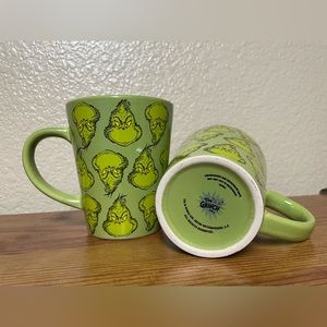 A set of 2 Dr. Seuss Grinch Coffee Mug Cups.